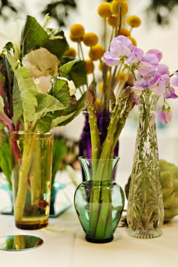 vegetables in assorted vases tablescape