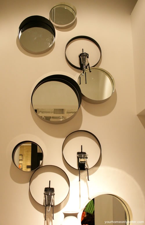 bowls mirrors and plates as wall art