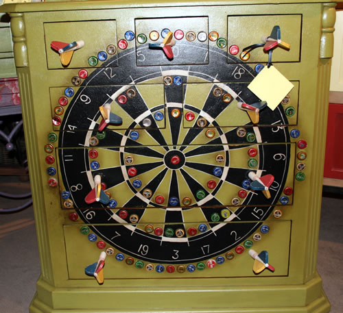 game of darts painted on dresser