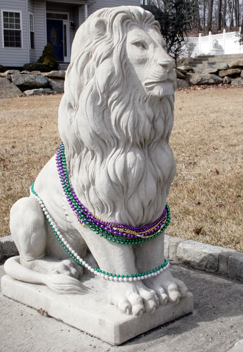 lion statues dressed for mardi gras