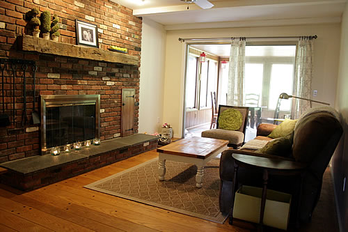 family room with brick fireplace and wide plank floor