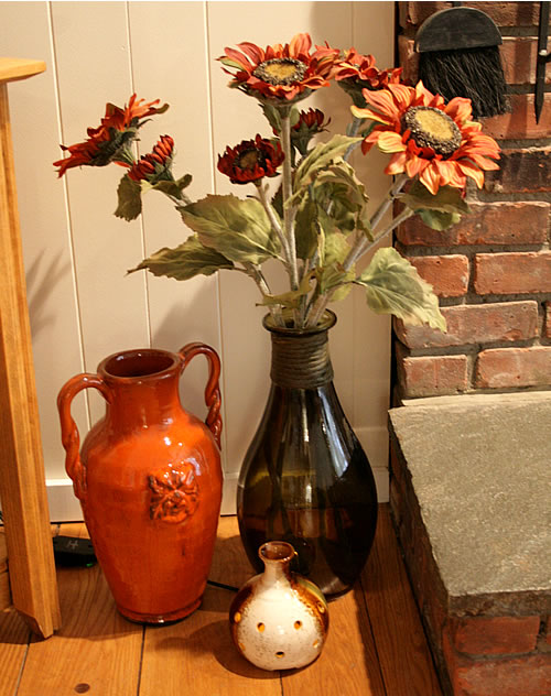 grouping of orange and green vases