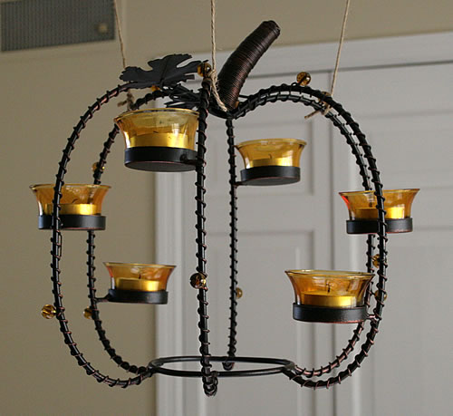 hanging a thanksgiving pumpkin centerpiece from chandelier