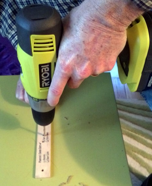 drilling holes in cabinet