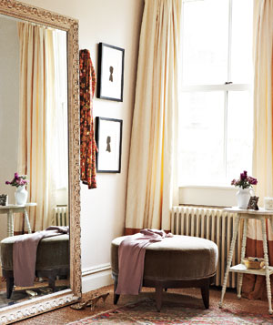 mirror and ottoman in dressing room