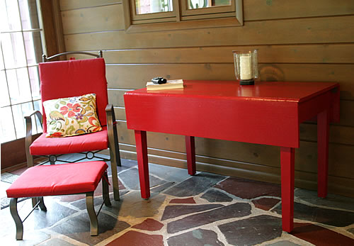 refinished red table at home in the sun room